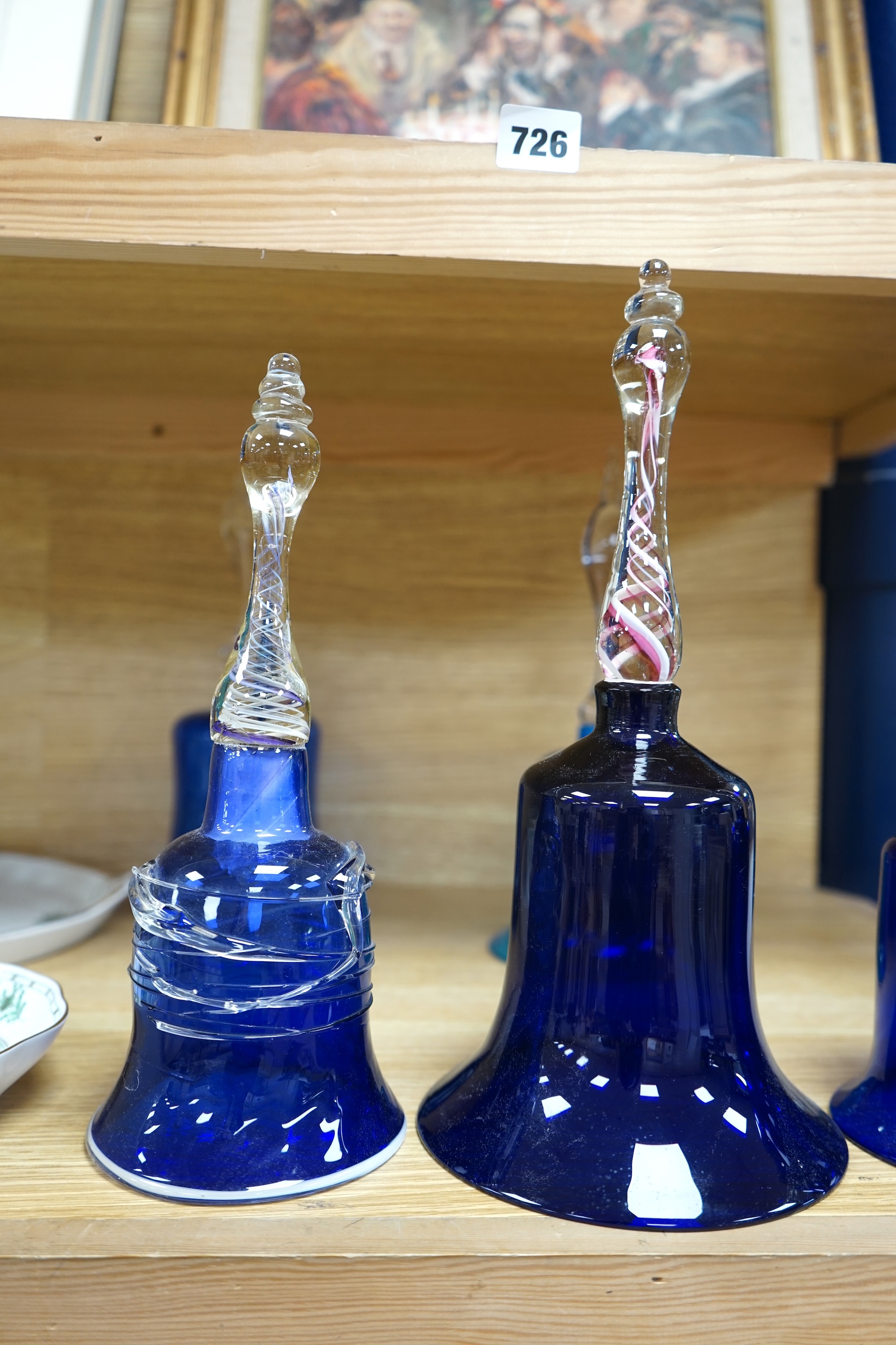 Five Victorian blue glass bells, two with air twist handles, 32cm high. Condition - fair to good